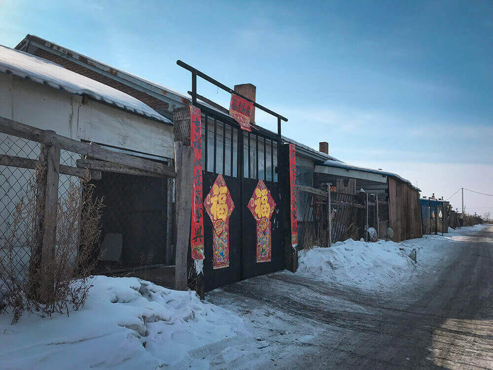 Decorations cover the gate of the host family’s house at Chinese New Year.