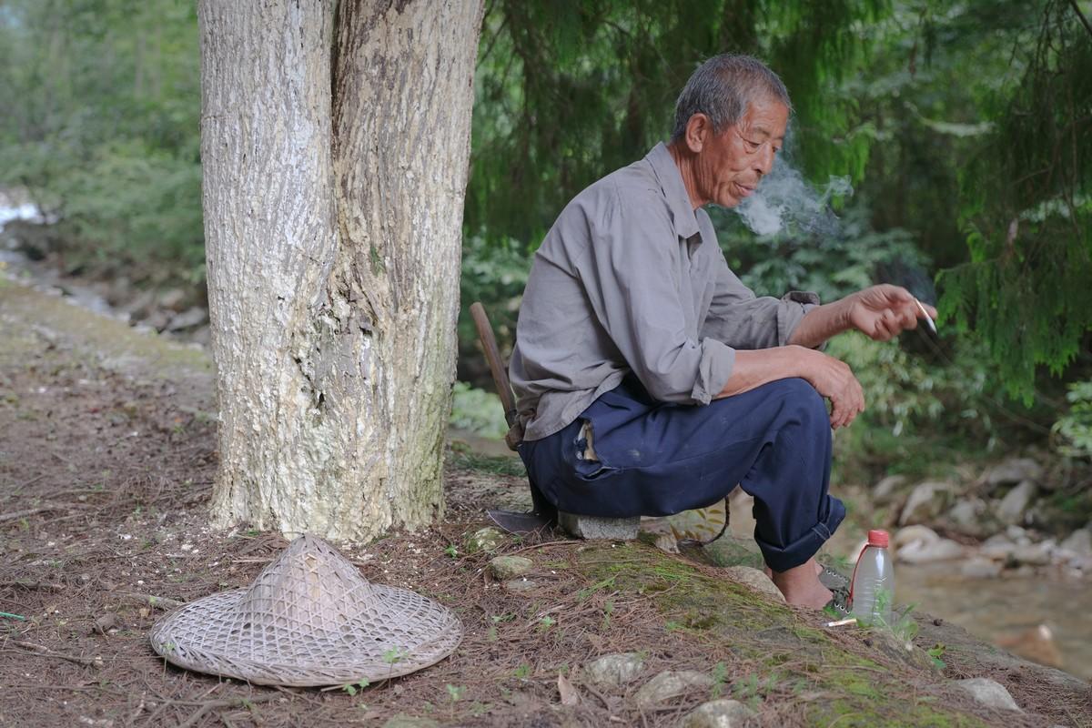 A 72-year-old cowherd smokes